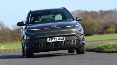 Honda e:Ny1 vs Hyundai Kona Electric - Hyundai Kona Electric front cornering 